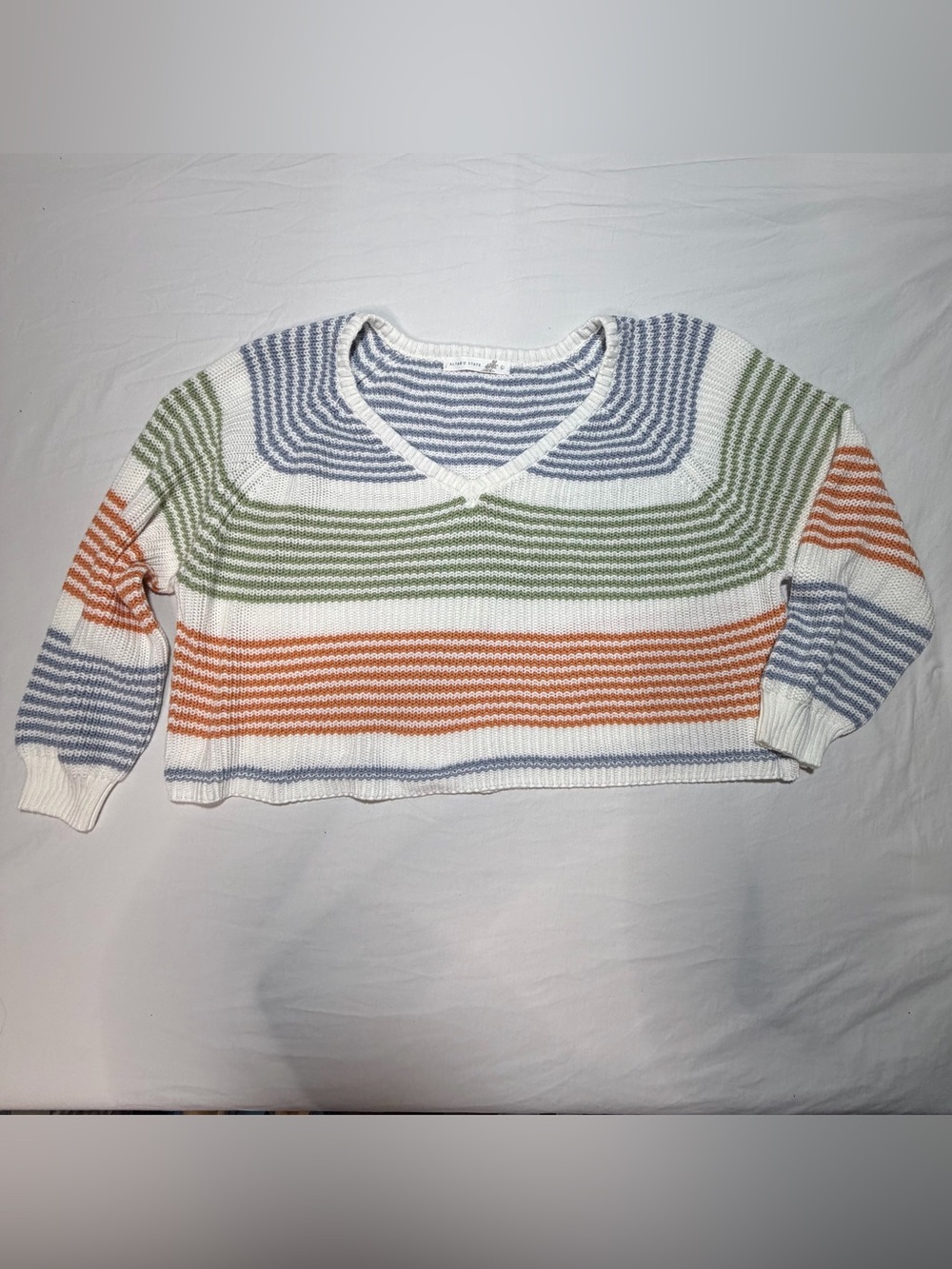 Altar'd State White V‑Neck Sweater with Blue, Green & Orange Stripes